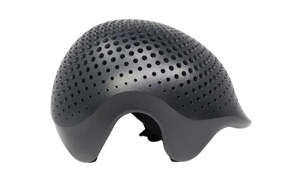 The same helmet shell after vapor smoothing on a PostPro SF2X, with a smooth, sealed dark surface