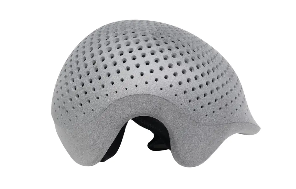 3D-printed lattice helmet shell as printed, with a matte grey, grainy surface